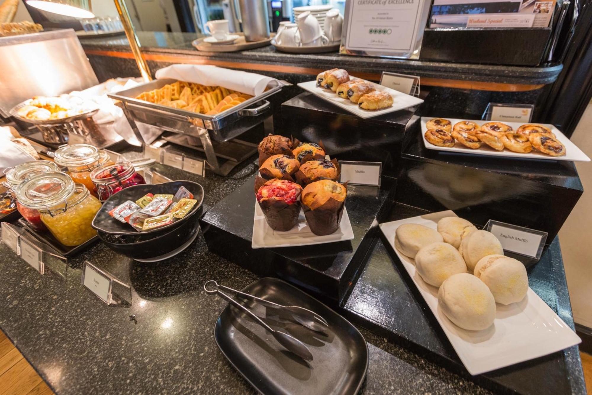 Cape House Langsuan Hotel Bangkok Exterior photo A selection of desserts at a buffet