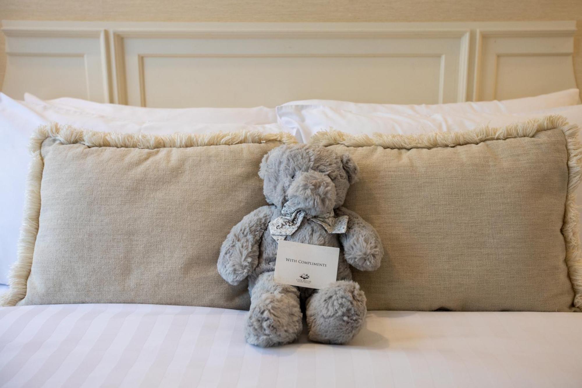 Cape House Langsuan Hotel Bangkok Exterior photo A teddy bear left on a bed at the Ritz-Carlton, Boston
